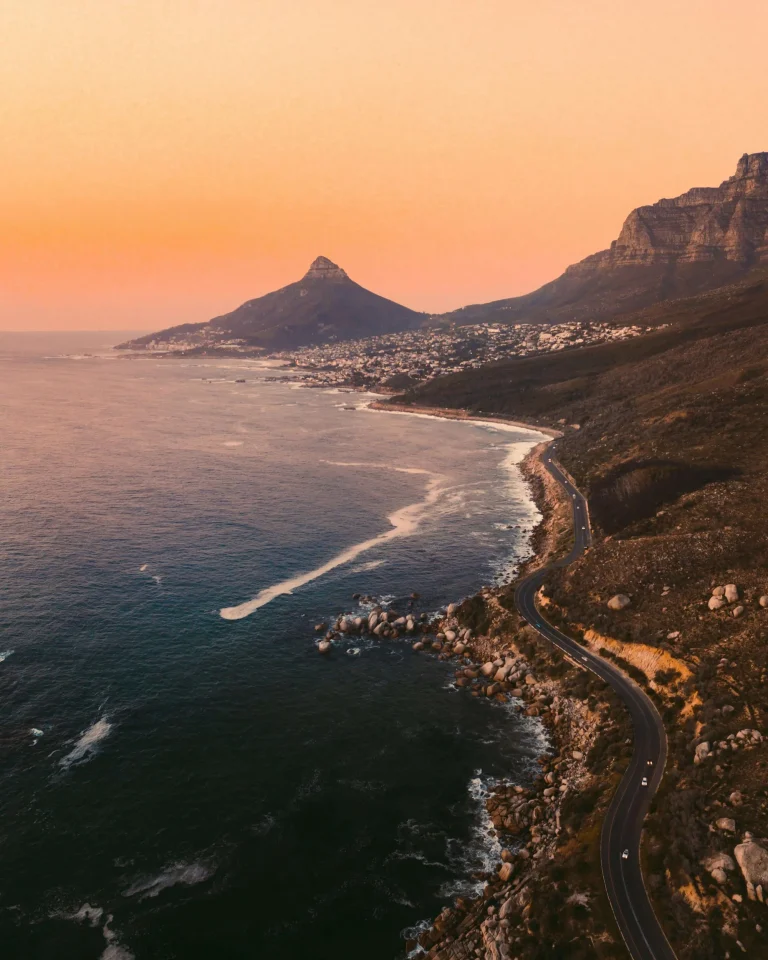 Sunset view of the Atlantic coastline near Cape Town with mountains and ocean